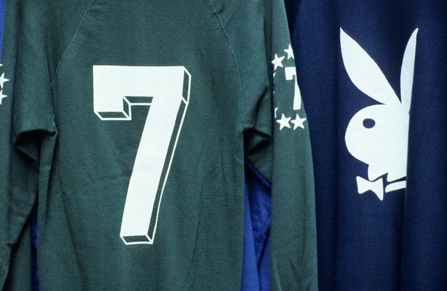 A dark green football shirt with a white 7 on the back and the arm